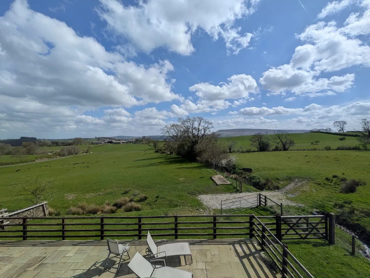 View across the stone terrace towards Pendle Hill