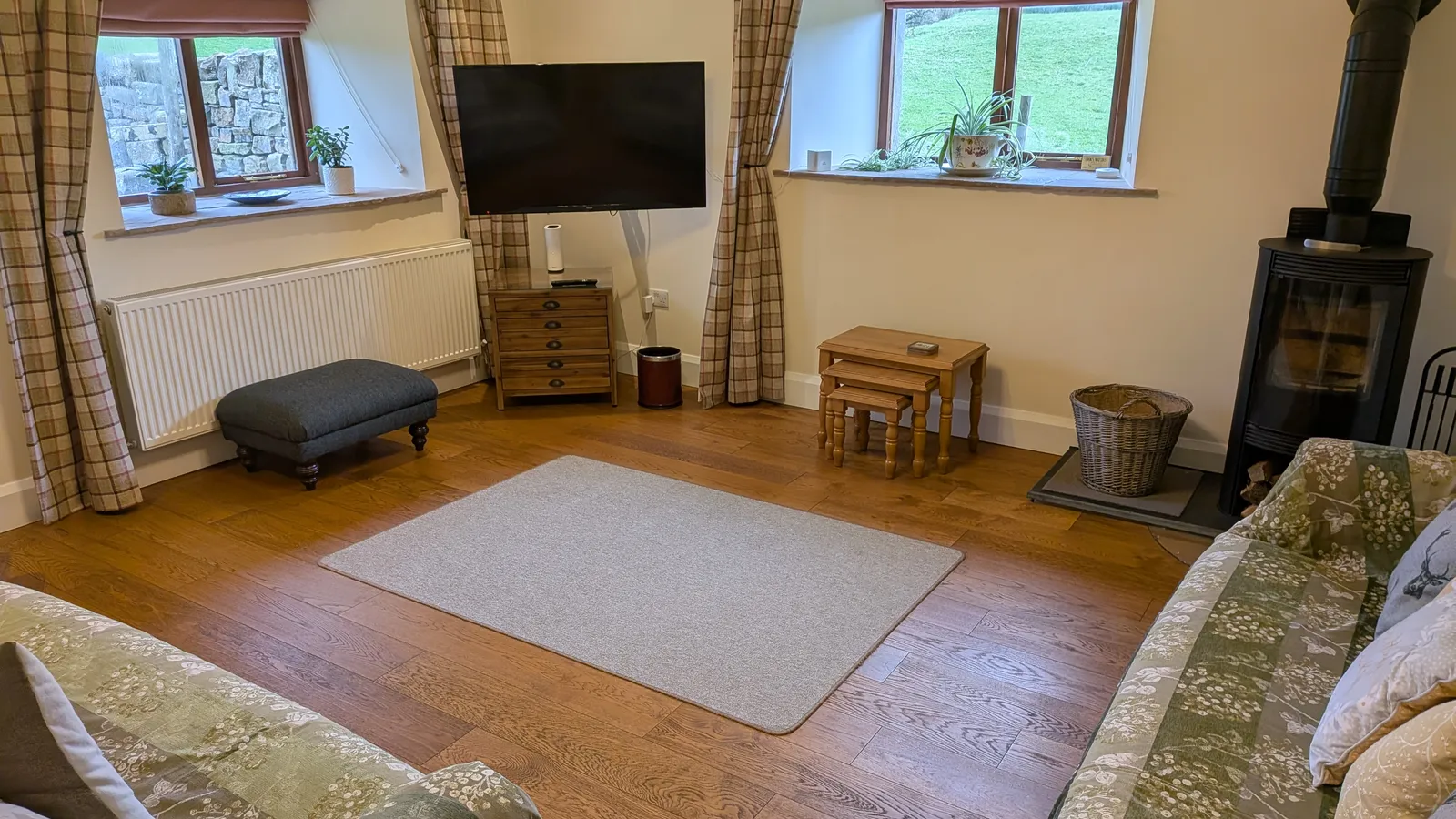 Living room with log burner at Hill Brook Barn