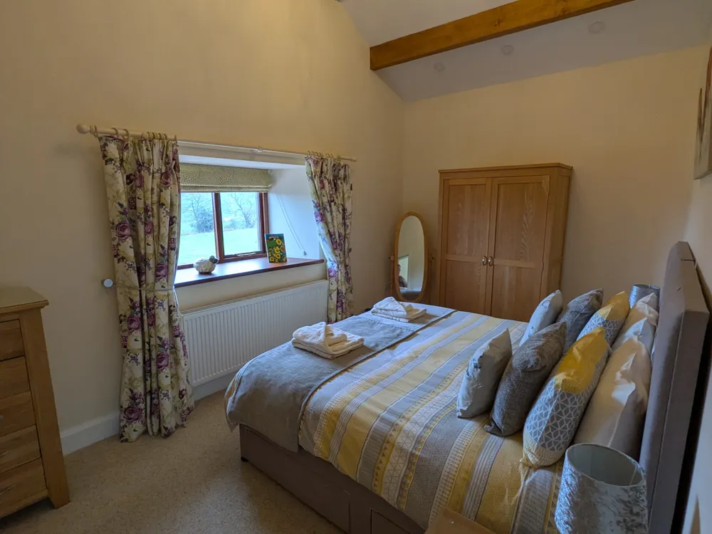 Second bedroom with vaulted ceiling at Hill Brook Barn