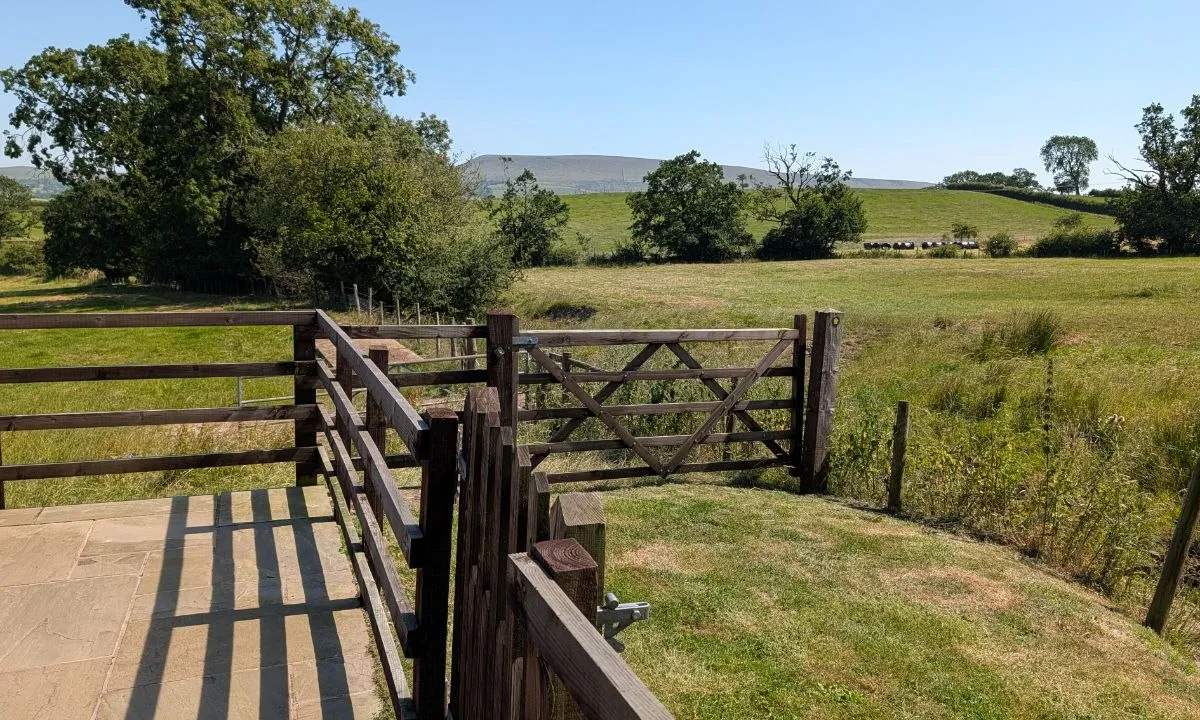 Open fields and distant hills seen from the barn